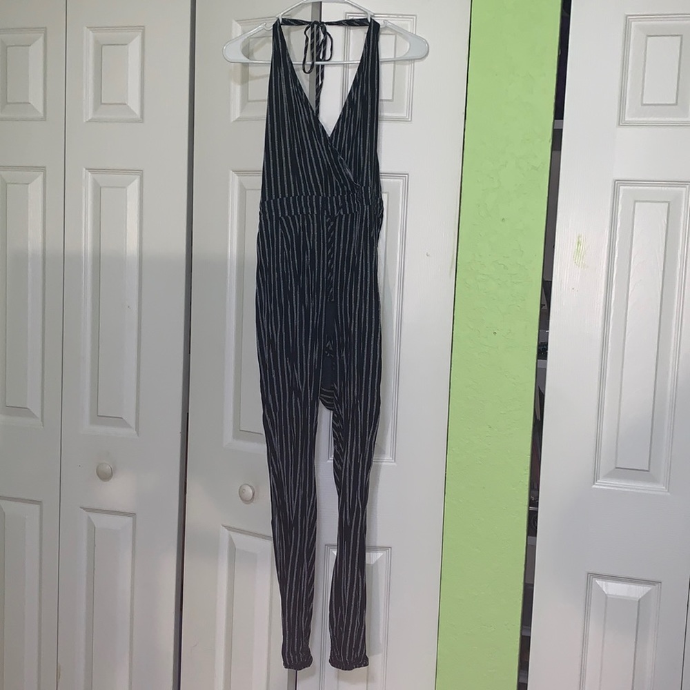 Navy striped jumpsuit. Open back and leg slits